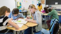 Photo of elementary students working on a project